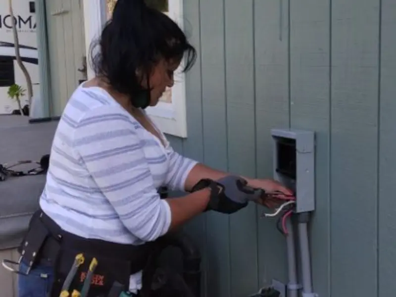 Licensed electrician wiring an exterior subpanel in Mine Hill