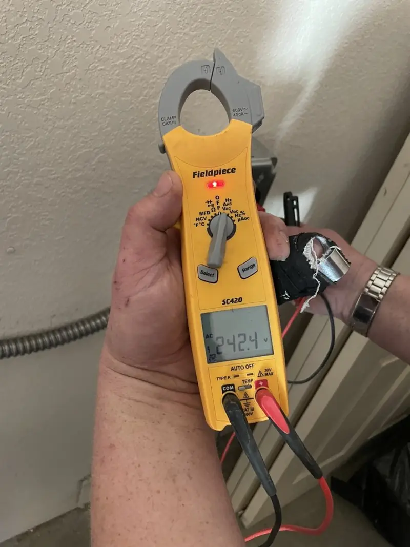 Voltage testing with clamp meter during Recessed Lighting Installation in Mine Hill